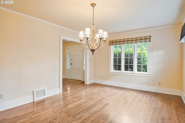 1702 24th Ave, Longview, WA 98632 - empty room with wood finished floors, a chandelier, and ornamental molding