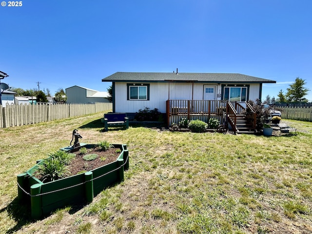 516 W Railroad Ave, Goldendale, WA 98620 - rear view of property featuring a yard, a deck, and fence