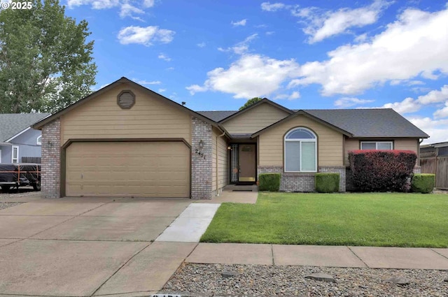 2451 Bowtie Ave, Eugene, OR 97404 - single story home with brick siding, an attached garage, and driveway