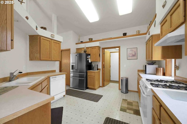 2451 Bowtie Ave, Eugene, OR 97404 - kitchen with appliances with stainless steel finishes, light countertops, light floors, under cabinet range hood, and vaulted ceiling