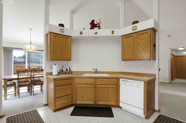 2451 Bowtie Ave, Eugene, OR 97404 - kitchen featuring dishwasher, pendant lighting, light countertops, a chandelier, and brown cabinets