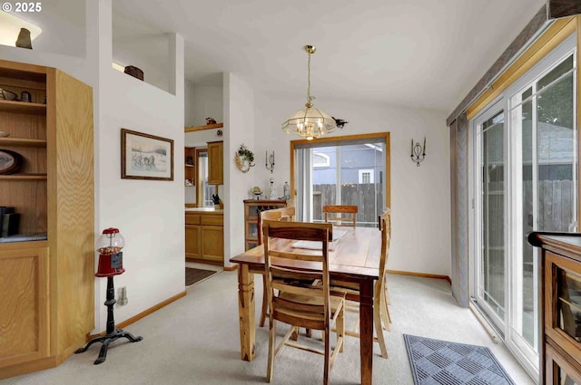 2451 Bowtie Ave, Eugene, OR 97404 - dining space with a chandelier, light colored carpet, and vaulted ceiling