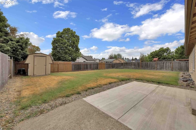 2451 Bowtie Ave, Eugene, OR 97404 - fenced backyard with a storage unit and a patio