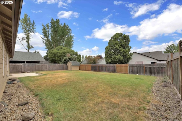 2451 Bowtie Ave, Eugene, OR 97404 - fenced backyard with a storage shed and a patio area