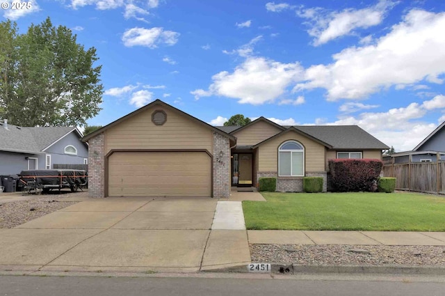 2451 Bowtie Ave, Eugene, OR 97404 - single story home with brick siding, a garage, and driveway