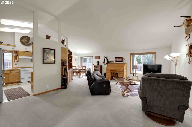 2451 Bowtie Ave, Eugene, OR 97404 - living room with a chandelier and light colored carpet