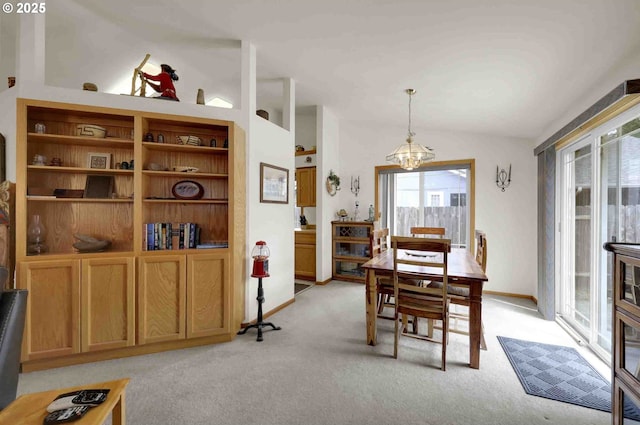 2451 Bowtie Ave, Eugene, OR 97404 - dining area featuring a chandelier, light carpet, and vaulted ceiling