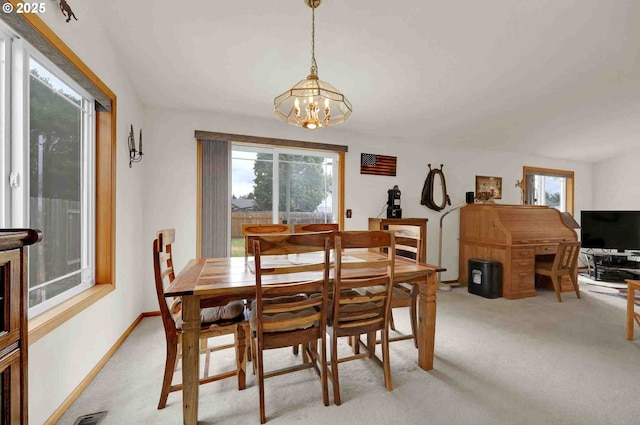 2451 Bowtie Ave, Eugene, OR 97404 - dining space featuring light colored carpet and a chandelier