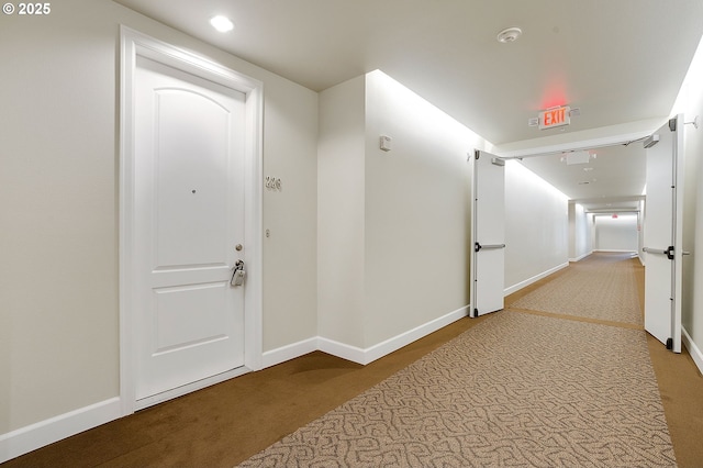 corridor with carpet flooring