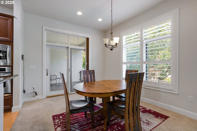 dining area featuring a chandelier