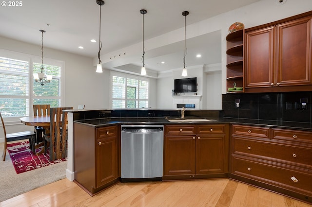 kitchen featuring sink, decorative light fixtures, light hardwood / wood-style flooring, dishwasher, and decorative backsplash