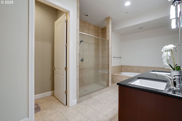 bathroom with tile patterned floors, plus walk in shower, and sink