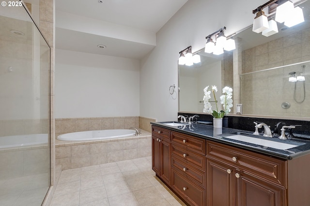 bathroom with tile patterned floors, independent shower and bath, and vanity