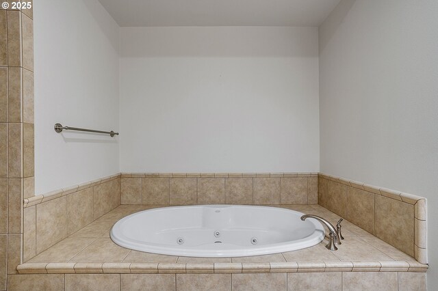 bathroom with a relaxing tiled tub