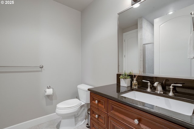 bathroom featuring tile patterned flooring, vanity, a shower with door, and toilet