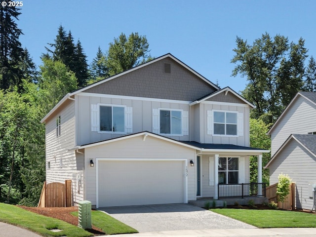 1572 NE Josephine Ct Unit 178, Estacada, OR 97023 - view of front facade with a porch, board and batten siding, driveway, and a garage