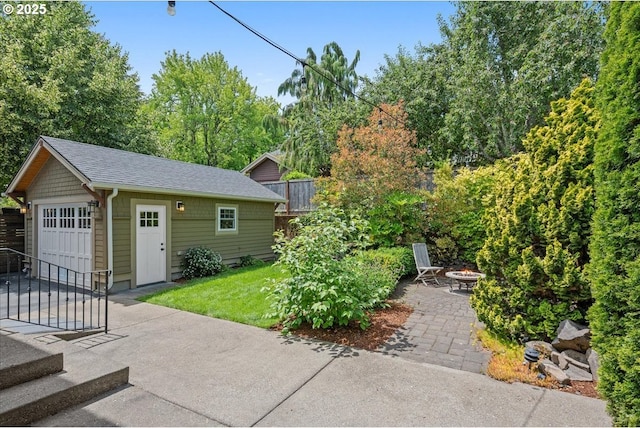 7525 SE 18th Ave, Portland, OR 97202 - view of patio featuring an outdoor fire pit and an outbuilding