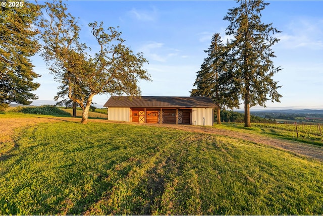8810 NE Blackburn Rd, Yamhill, OR 97148 - detached garage featuring driveway and a view of rural / pastoral area