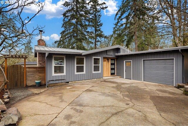 ranch-style house featuring a garage