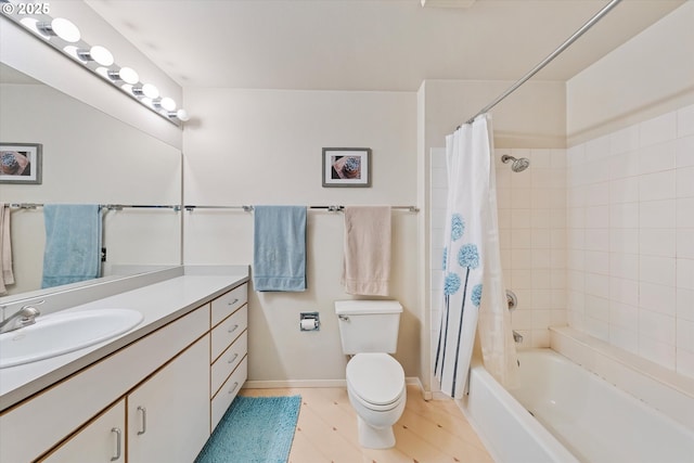 full bath featuring toilet, baseboards, vanity, shower / bath combination with curtain, and wood finished floors