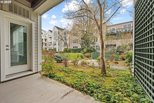 view of yard with fence and a residential view