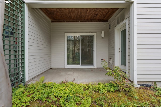 doorway to property with a patio area