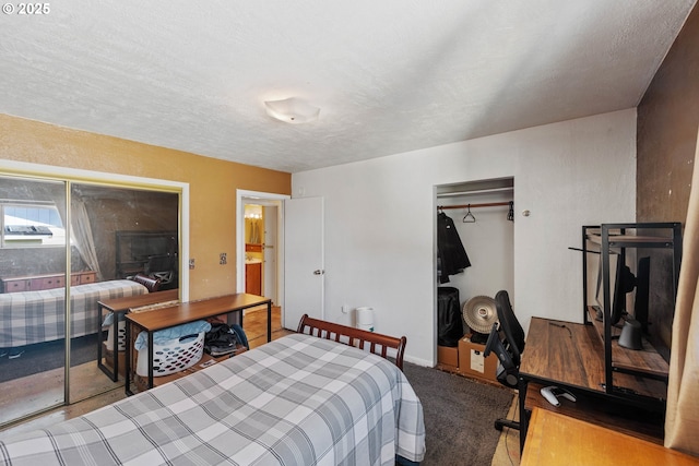 bedroom featuring a closet, a textured ceiling, and carpet floors