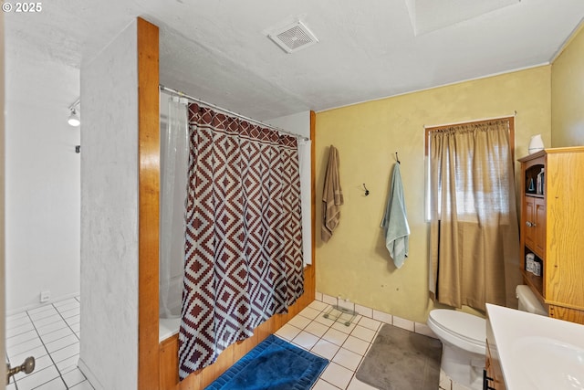 bathroom featuring visible vents, curtained shower, toilet, tile patterned floors, and vanity