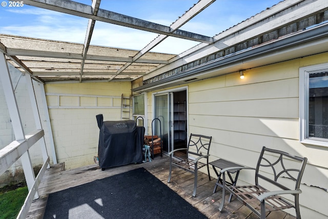 view of patio / terrace featuring glass enclosure