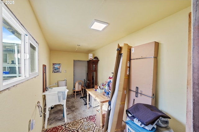 home office featuring concrete flooring