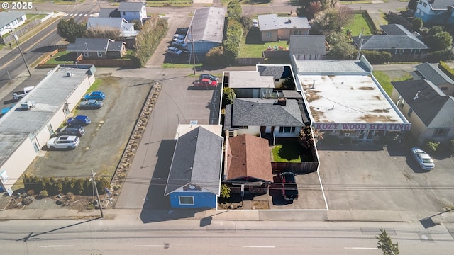 birds eye view of property with a residential view