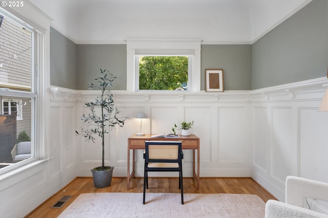 2215 NE 24th Ave, Portland, OR 97212 - sitting room with a decorative wall, wood finished floors, a wainscoted wall, and ornamental molding