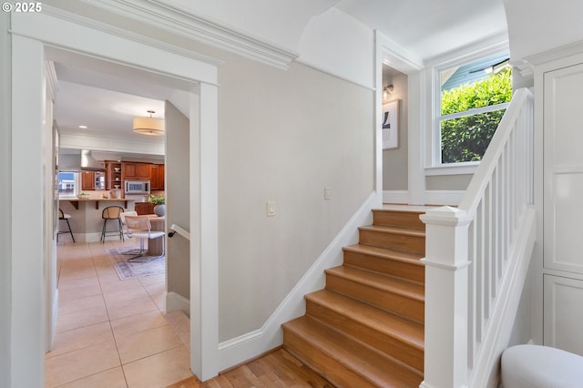 2215 NE 24th Ave, Portland, OR 97212 - staircase featuring tile patterned flooring and crown molding