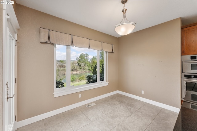 205 W Oriole Dr, Roseburg, OR 97471 - unfurnished dining area featuring light tile patterned floors, visible vents, and baseboards