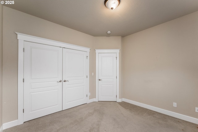 205 W Oriole Dr, Roseburg, OR 97471 - unfurnished bedroom with a closet, carpet flooring, and baseboards