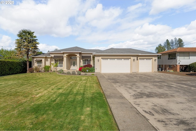 205 W Oriole Dr, Roseburg, OR 97471 - prairie-style home featuring a front yard, driveway, a garage, and stucco siding