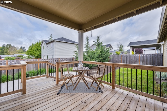 wooden deck featuring a fenced backyard and outdoor dining space