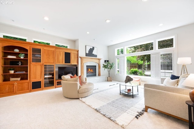 3830 NW 142nd Ter, Portland, OR 97229 - carpeted living room featuring a fireplace and recessed lighting