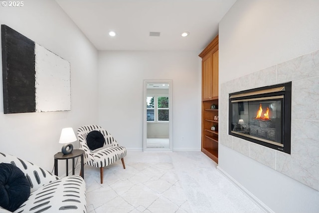 3830 NW 142nd Ter, Portland, OR 97229 - sitting room featuring light carpet, recessed lighting, a tiled fireplace, and baseboards