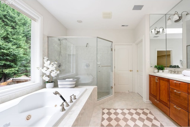 3830 NW 142nd Ter, Portland, OR 97229 - full bathroom with vanity, a tub with jets, a stall shower, and tile patterned flooring