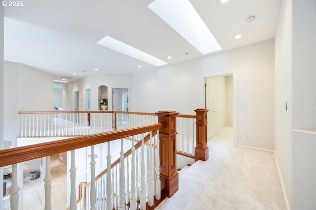 3830 NW 142nd Ter, Portland, OR 97229 - hall featuring an upstairs landing, a skylight, light colored carpet, recessed lighting, and baseboards