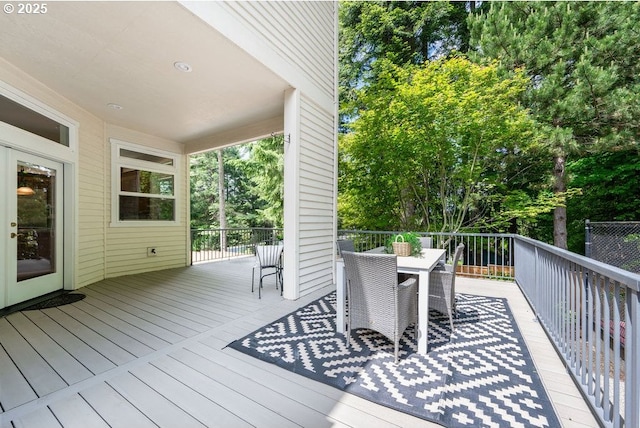 3830 NW 142nd Ter, Portland, OR 97229 - wooden terrace featuring outdoor dining space and view of wooded area