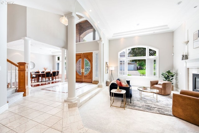 3830 NW 142nd Ter, Portland, OR 97229 - entrance foyer with ornate columns, a high ceiling, recessed lighting, stairway, and a premium fireplace