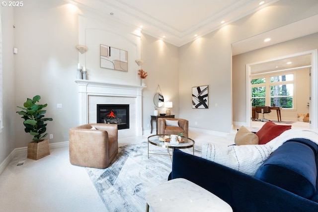 3830 NW 142nd Ter, Portland, OR 97229 - living room with ornamental molding, a glass covered fireplace, recessed lighting, and light colored carpet