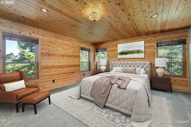carpeted bedroom with multiple windows, wood walls, wood ceiling, and recessed lighting