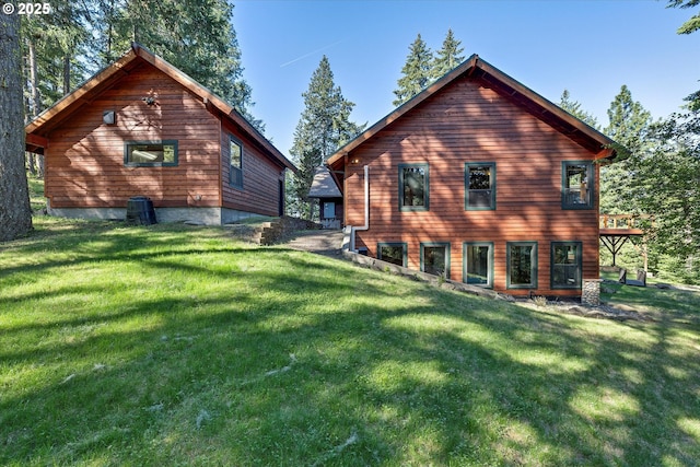 rear view of house with a yard