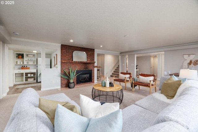 living room featuring a fireplace, recessed lighting, light carpet, a textured ceiling, and stairs