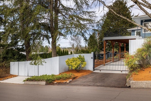 view of gate featuring fence