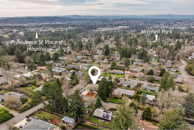 drone / aerial view with a residential view and a mountain view