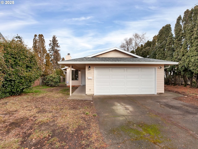 ranch-style house featuring a garage